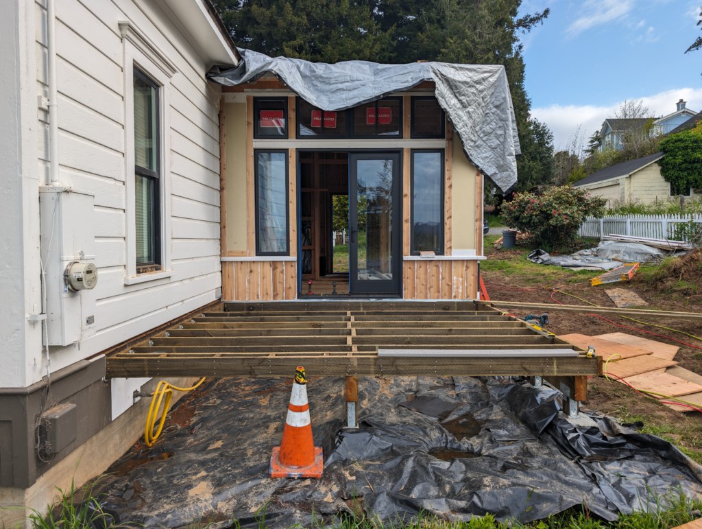 The foundation of the deck for the addition to the Shotgun house being laid out.