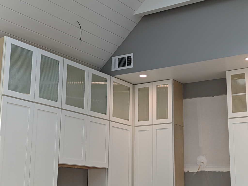 New cabinets and electrical ready for fresh appliances and fixtures in the kitchen remodel of the Shotgun house.