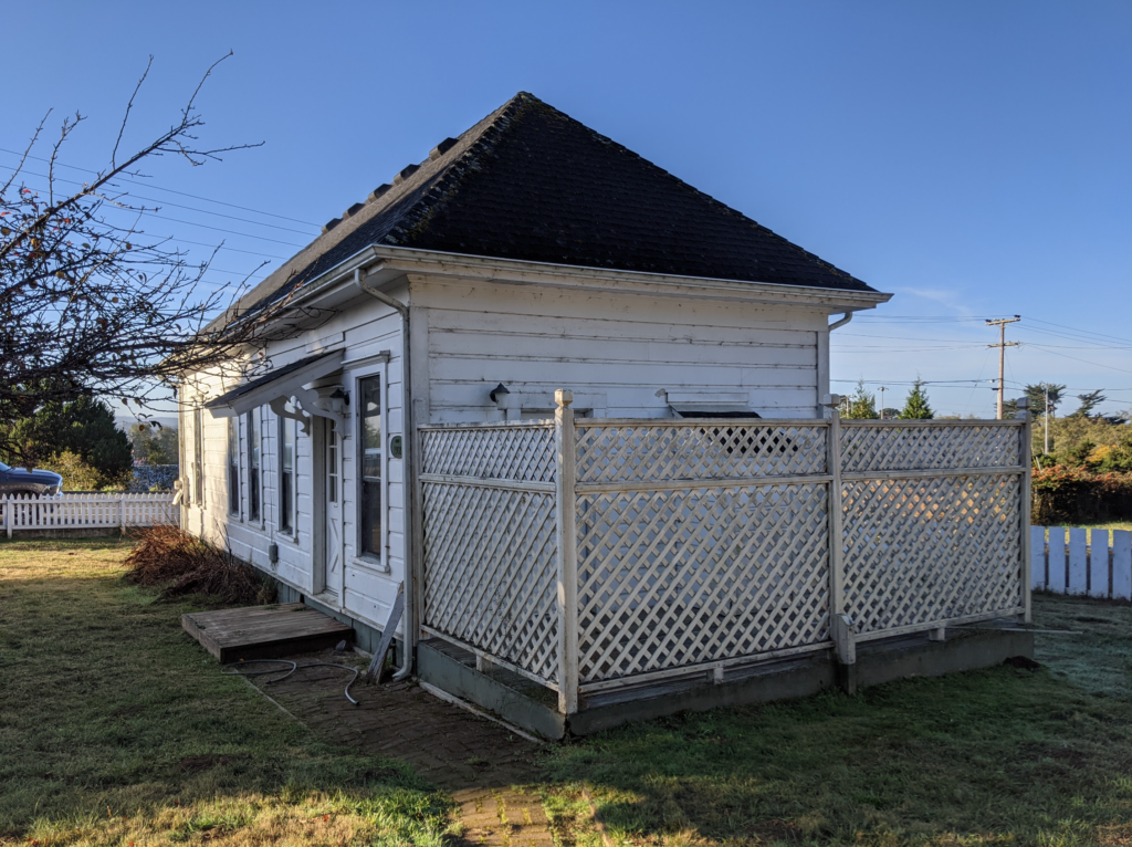 Back exterior of the historic Shotgun house, again showing the length and narrowness of the house's original footprint.
