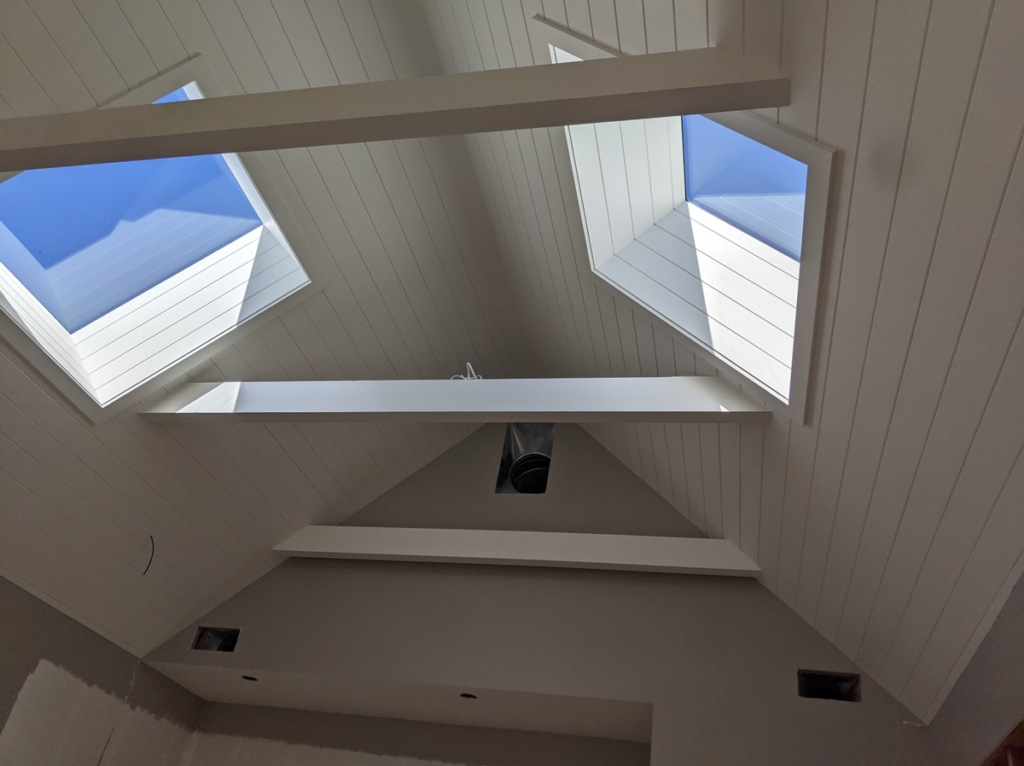 Another view of the skylights and beams in the shotgun house remodel.