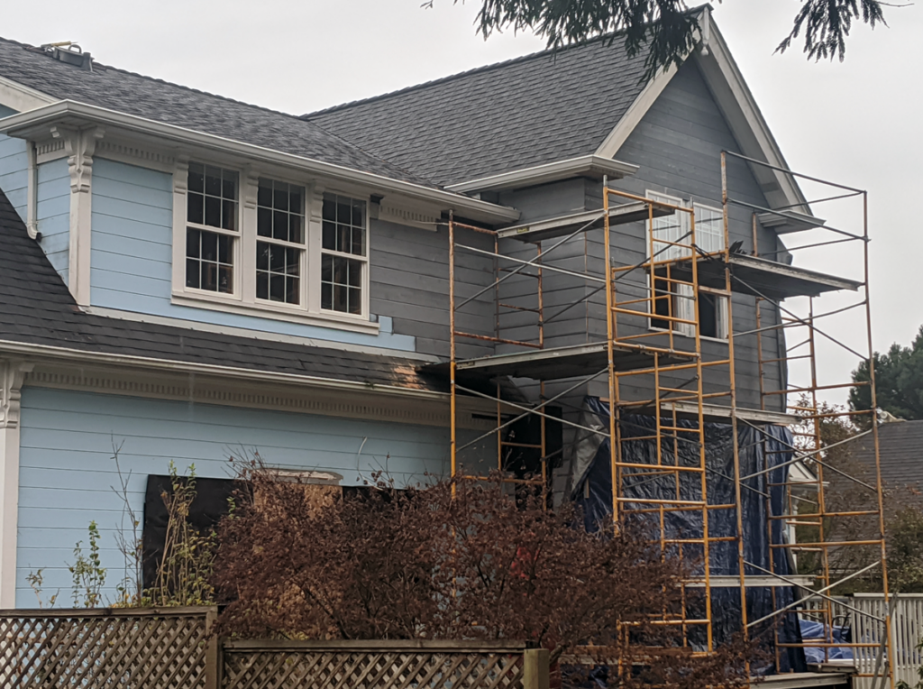 Exterior view of the scaffolding used to add siding to the Victorian Remodel.