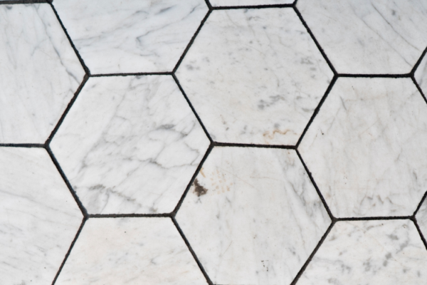 tile-texture Detailed view of hexagonal tiles with a white marble texture.